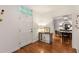 Bright foyer with hardwood floors, a console table, and a view into the adjacent dining room at 130 River Ne Lndg, Sandy Springs, GA 30350