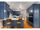 Remodeled kitchen has updated appliances, white counters and custom blue cabinets at 130 River Ne Lndg, Sandy Springs, GA 30350