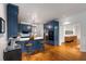 Open-concept kitchen with stylish blue cabinets, a breakfast bar, and stainless steel appliances, perfect for modern living at 130 River Ne Lndg, Sandy Springs, GA 30350