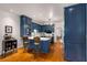 Well-designed kitchen featuring a breakfast bar, blue cabinetry, and hardwood floors for a functional, stylish space at 130 River Ne Lndg, Sandy Springs, GA 30350