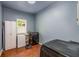Functional laundry room with brick floors, a utility sink, and modern washer and dryer units at 130 River Ne Lndg, Sandy Springs, GA 30350