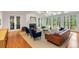 Spacious living room with fireplace, hardwood floors, ample seating and French doors at 130 River Ne Lndg, Sandy Springs, GA 30350