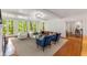 Bright and airy living room with hardwood floors, large windows, and comfortable seating arrangement at 130 River Ne Lndg, Sandy Springs, GA 30350