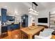 Open floor plan with kitchen, dining and living areas featuring hardwood floors and natural light at 130 River Ne Lndg, Sandy Springs, GA 30350