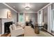Stylish office boasts a fireplace, modern lighting, and ample natural light perfect for a productive workspace at 130 River Ne Lndg, Sandy Springs, GA 30350