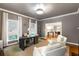 Bright office with a unique desk, fireplace, and large windows offering a comfortable and inspiring workspace at 130 River Ne Lndg, Sandy Springs, GA 30350