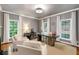 A serene office featuring a stone desk, fireplace, and plenty of natural light for a productive work environment at 130 River Ne Lndg, Sandy Springs, GA 30350
