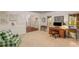 Well-lit office space with a wooden desk, patterned armchair, and windows overlooking the outdoors at 130 River Ne Lndg, Sandy Springs, GA 30350