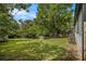 Backyard featuring an expanse of green grass and mature trees at 1926 Lakewood Se Ter, Atlanta, GA 30315