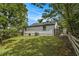 Expansive backyard featuring a well-maintained lawn and a fenced perimeter for added privacy and security at 1926 Lakewood Se Ter, Atlanta, GA 30315