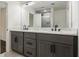 Bathroom featuring a double sink vanity and large mirror at 1926 Lakewood Se Ter, Atlanta, GA 30315