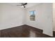 Bedroom featuring hardwood floors, a ceiling fan, and a window at 1926 Lakewood Se Ter, Atlanta, GA 30315
