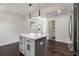 Kitchen island featuring gray cabinets, quartz countertops, and modern pendants at 1926 Lakewood Se Ter, Atlanta, GA 30315