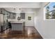Modern kitchen featuring gray cabinets, stainless steel appliances, and a center island at 1926 Lakewood Se Ter, Atlanta, GA 30315