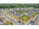 An aerial view highlighting a quiet suburban neighborhood with uniform housing and tree-lined streets at 4591 Grenadine Cir, Acworth, GA 30101