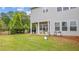 A quaint backyard with a small patio area and a lush green lawn, perfect for outdoor relaxation at 4591 Grenadine Cir, Acworth, GA 30101
