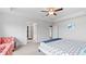 A spacious bedroom with modern ceiling fan, stylish furnishings, and an ensuite bathroom at 4591 Grenadine Cir, Acworth, GA 30101