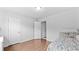 Spare bedroom with wood floors, two doors and a window providing ample natural light at 4591 Grenadine Cir, Acworth, GA 30101