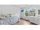 Bedroom with hardwood flooring, window with view, and a dresser at 4591 Grenadine Cir, Acworth, GA 30101