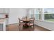 Cozy dining area with a round table, natural light, and a view of the outdoors at 4591 Grenadine Cir, Acworth, GA 30101