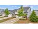 Well-maintained gray two-story home with a brick-accented garage and landscaped front yard at 4591 Grenadine Cir, Acworth, GA 30101