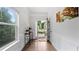 Bright foyer with hardwood floors, elegant trim, and a view of the landscaped front yard at 4591 Grenadine Cir, Acworth, GA 30101