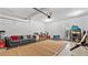 Organized garage space with room for storage and activities with a comfortable sofa at 4591 Grenadine Cir, Acworth, GA 30101