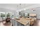 Open-concept kitchen with granite countertops, stainless steel appliances, and seamless transition to the living area at 4591 Grenadine Cir, Acworth, GA 30101