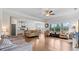 Open-concept living room with hardwood floors, bright windows, and a seamless flow to the kitchen at 4591 Grenadine Cir, Acworth, GA 30101