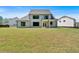 Well-maintained two-story home boasting a large yard, covered patio, and large black frame windows at 4708 Cooling Water Sw Cir, Powder Springs, GA 30127
