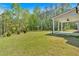 Lush green backyard features views of dense trees at 4708 Cooling Water Sw Cir, Powder Springs, GA 30127