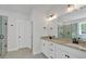 Bathroom with double granite vanity, white cabinetry, and glass enclosed shower, and tile floors at 4708 Cooling Water Sw Cir, Powder Springs, GA 30127