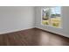 Cozy, bright bedroom with hardwood floors and a large picture window overlooking the green yard at 4708 Cooling Water Sw Cir, Powder Springs, GA 30127