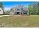 New construction home with lush green lawn, brick and gray siding, and architectural details, and an attached garage at 4708 Cooling Water Sw Cir, Powder Springs, GA 30127