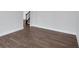 Bright, large living room with hardwood floors. Stairs visible in background at 4708 Cooling Water Sw Cir, Powder Springs, GA 30127