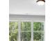 Bright window with views of lush, mature landscaping and dense green trees at 4708 Cooling Water Sw Cir, Powder Springs, GA 30127