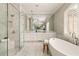 Bright bathroom with a freestanding tub, walk-in shower, and large double sink vanity at 670 Trinity Pl, Suwanee, GA 30024