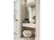 Cozy bathroom vanity with white stool, mirror, and natural light from window at 670 Trinity Pl, Suwanee, GA 30024