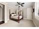 Bedroom featuring a four poster bed and windows with plantation shutters at 670 Trinity Pl, Suwanee, GA 30024