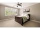Serene bedroom filled with natural light, featuring plantation shutters and artwork for a modern touch at 670 Trinity Pl, Suwanee, GA 30024