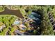 Aerial shot showcases the community amenities, including a pool, clubhouse, and tennis courts at 670 Trinity Pl, Suwanee, GA 30024