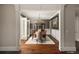 Formal dining room with hardwood floors, wainscoting, chandelier, and seating for eight at 670 Trinity Pl, Suwanee, GA 30024