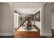 Elegant dining room boasts hardwood floors, a decorative chandelier and intricate trim work at 670 Trinity Pl, Suwanee, GA 30024