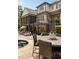 Rear exterior view of a home featuring a pool, patio, and lush landscaping, creating an inviting outdoor space at 670 Trinity Pl, Suwanee, GA 30024