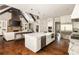 Spacious kitchen with a large island, white cabinetry, and stainless steel appliances at 670 Trinity Pl, Suwanee, GA 30024
