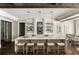 Modern kitchen featuring a spacious island with seating and stylish pendant lighting at 670 Trinity Pl, Suwanee, GA 30024