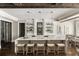 Gourmet kitchen with large island, marble countertops, pendant lighting and stainless steel appliances at 670 Trinity Pl, Suwanee, GA 30024