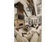Grand living room boasting a stone fireplace, exposed beams, and an open layout perfect for entertaining guests at 670 Trinity Pl, Suwanee, GA 30024