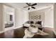 Sitting room with hardwood floors, a comfortable sofa, and a decorative rug at 670 Trinity Pl, Suwanee, GA 30024