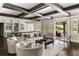 Open-concept living room with exposed beam ceiling, comfortable seating, and seamless flow to the backyard at 670 Trinity Pl, Suwanee, GA 30024